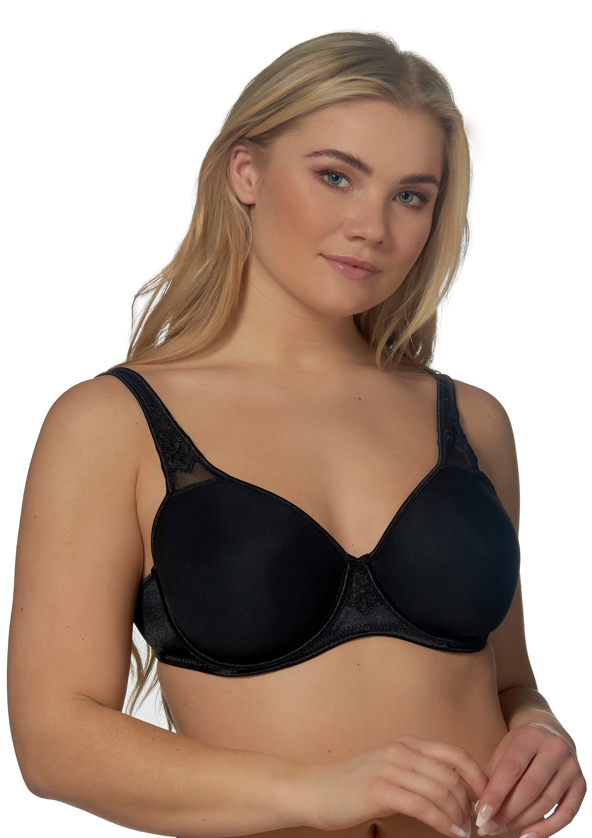 Woman wearing a black bra on a white background
